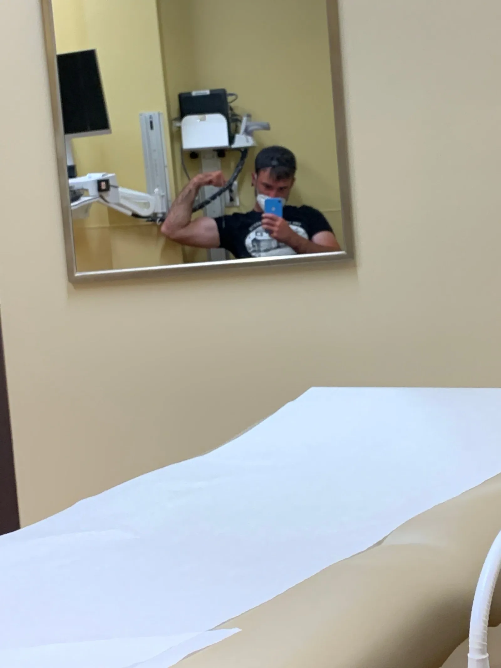 Mirror selfie in a doctor’s exam room