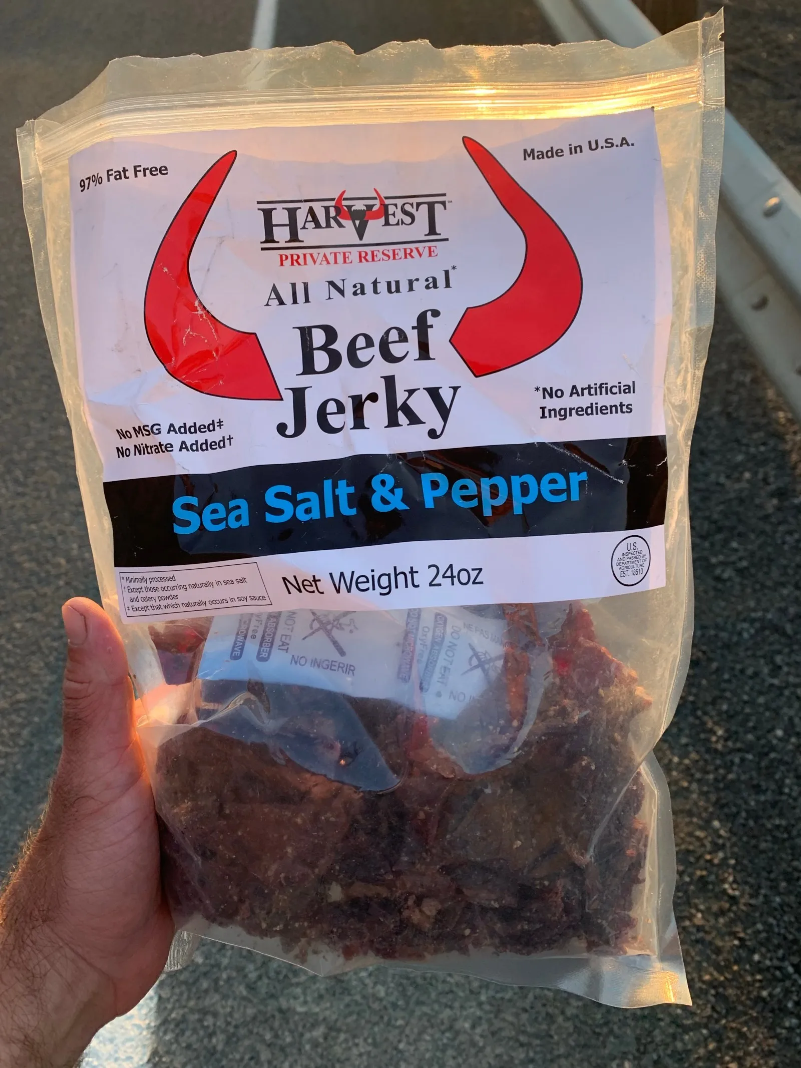 A 24-ounce bag of beef jerky held up to the camera